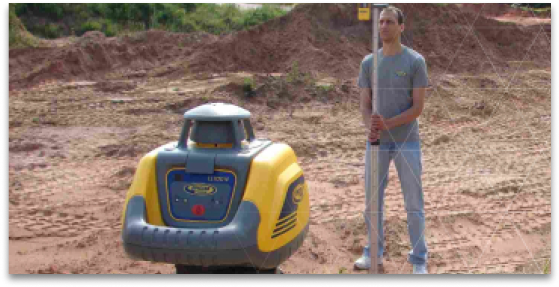 man standing next to laser level